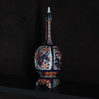 Rocket type decorative jar with stand